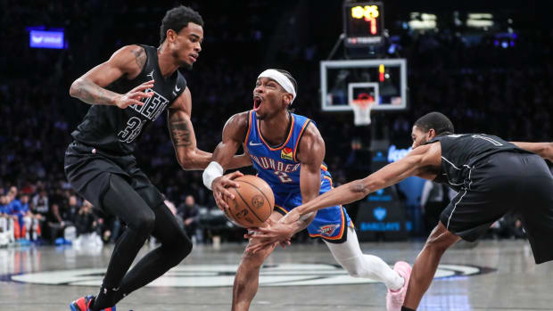 Oklahoma City Thunder guard Shai Gilgeous-Alexander (2) drives against Brooklyn Nets center Nic Claxton (33